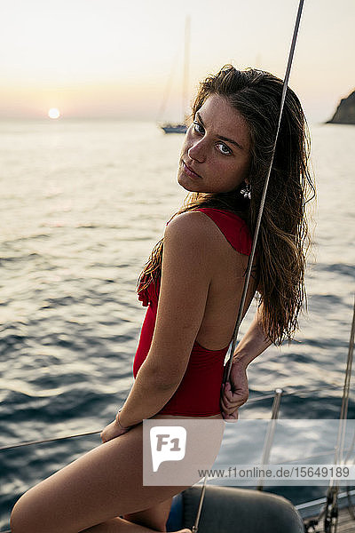 Portrait of young woman on sailboat  Italy
