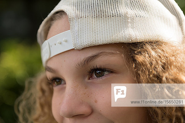 Close up of girl wearing baseball cap