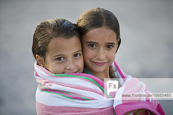Girls wrapped in towel in Miami  Florida  USA