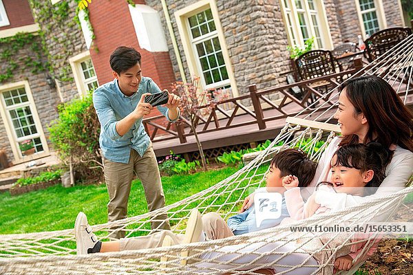 Happy family photographs in the yard