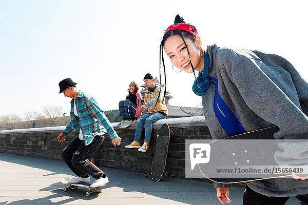 Young people skateboarding