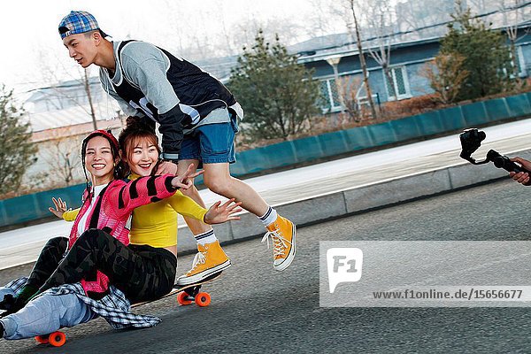 Young people skateboarding