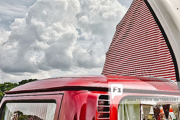 Red VW Camper van with red and white striped pop up roof open Nottingham Transport Festival Autokarna 2019 Wollaton Park Nottingham Nottinghamshire East Midlands United Kingdom