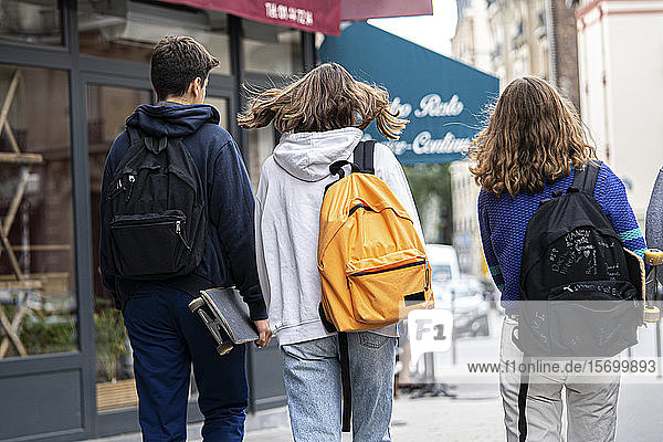 Friends walking on street