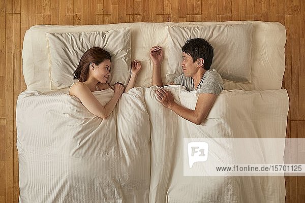Japanese couple in bed