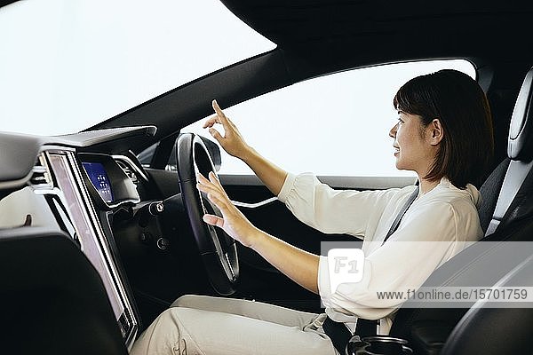 Japanese woman in self driving car