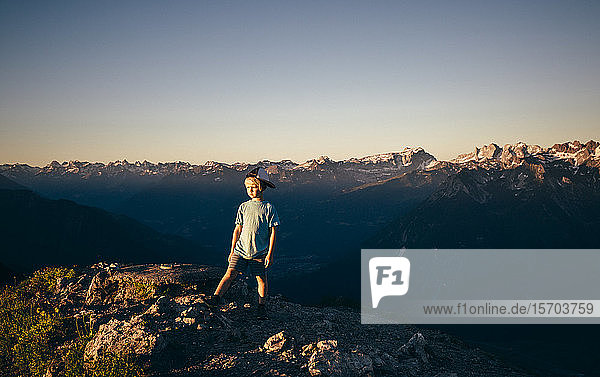 Boy enjoying view on peak Bludenz Vorarlberg Austria