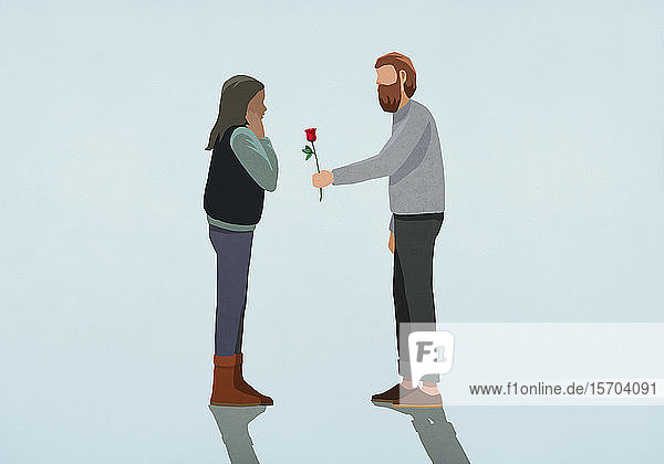 Mann schenkt seiner überraschten Freundin eine Rose