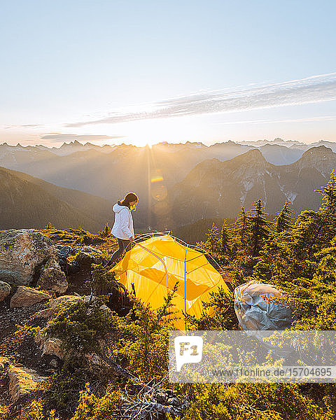 Female hiker camping on peak  Winchester Mountain  North Cascades  Washington  USA