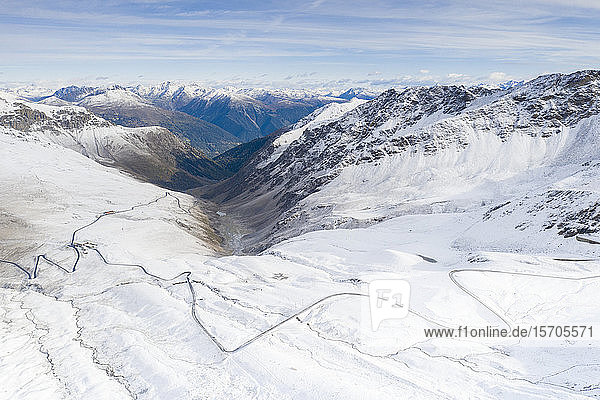 View by drone of mountain road in the snow Giogo di Santa Maria (Umbrail Pass) Stelvio Pass Sondrio province Valtellina Lombardy Italy Europe