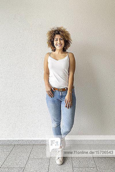 Smiling mid adult woman wearing jeans