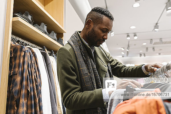 Stylish man shopping in a clothes store