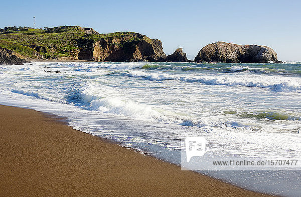 USA  California  San Francisco  Waves brushing sandy coastal beach of Marin Headlands
