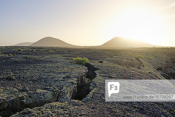 Spain  Canary Islands  Lanzarote  Monumento Natural de la Cueva de los Naturistas  Lava field at sunset