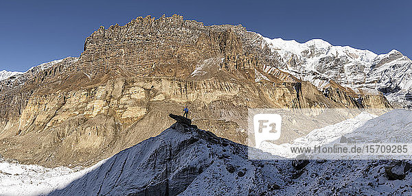 Mountaineer on top of a rock  Dhaulagiri Circuit Trek  Himalaya  Nepal