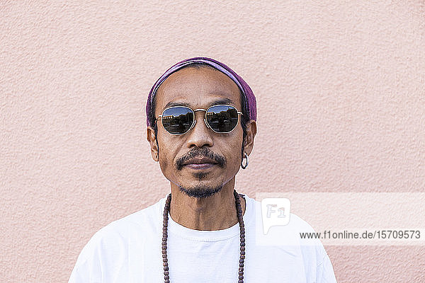 Portrait of mature man with headscarf and sunglasses