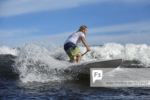SUP surfer Bali Indonesia