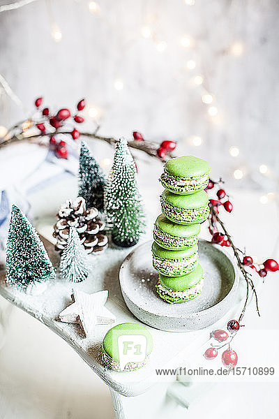 Stack of green macaroons and Christmas decorations