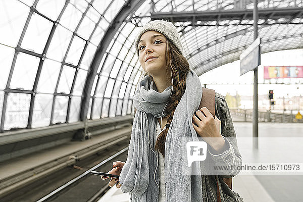 Young woman waiting at the station platform  Berlin  Germany