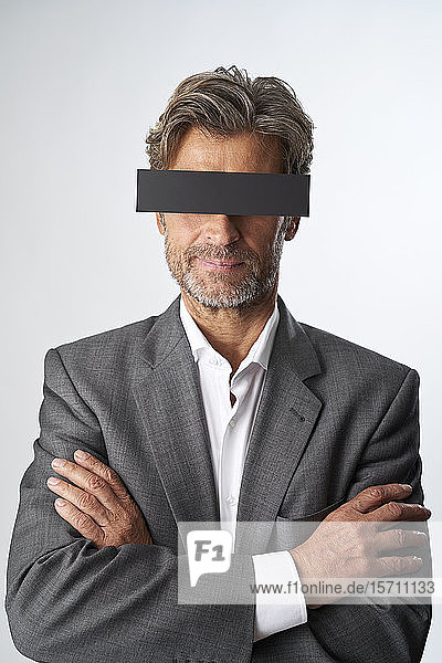 Portrait of mature man with censorship bar