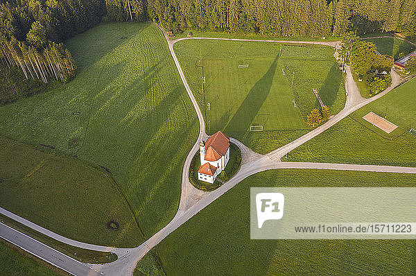 Germany  Upper Bavaria  Toelzer Land  Dietramszell  Aerial view of St. Leonhard church and soccer field