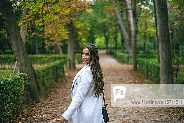 Portrait of a woman walking in a park