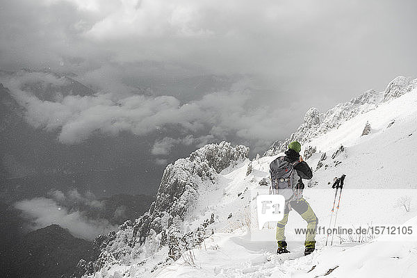 Mountaineer looking at distance  Italian Alps  Lecco  Lombardy  Italy
