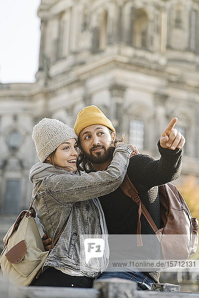 Happy young couple in the city with Berlin Cathedral in background  Berlin  Germany