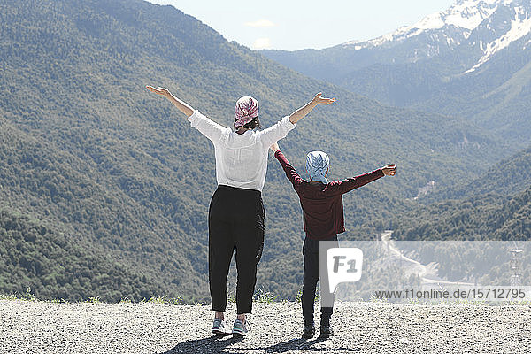 Mother and son enjoying mountain view  Sochi  Russia