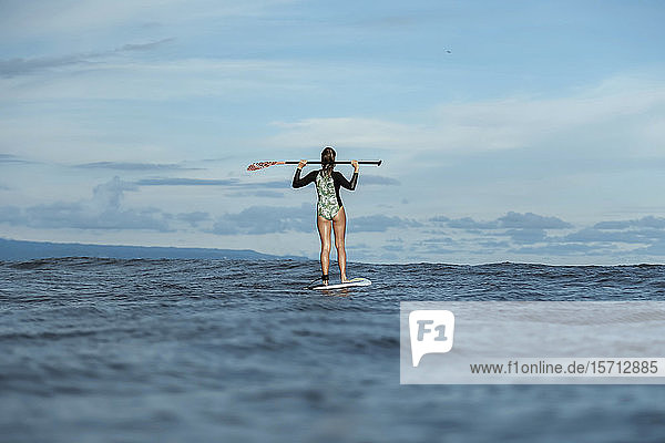 Female SUP surfer Bali Indonesia