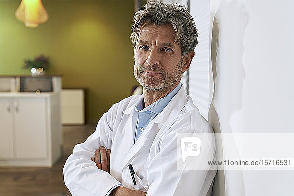 Portrait of confident doctor in his medical practice