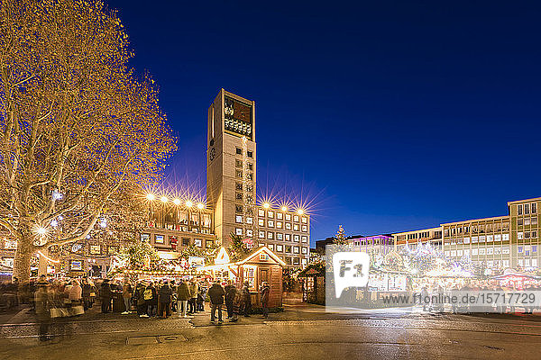 Germany  Baden-Wurttemberg  Stuttgart  Christmas market stalls and town hall at dusk