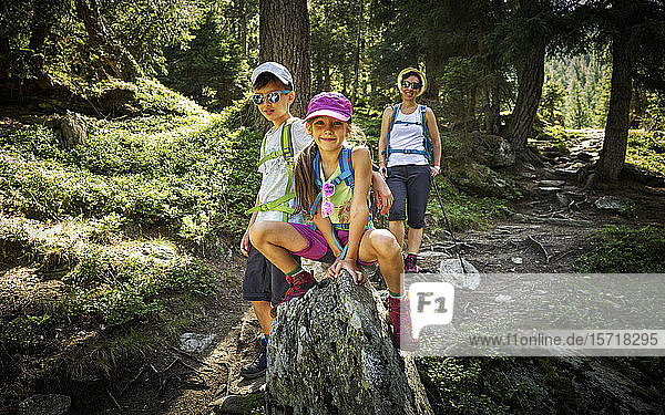 Portrait of mother with two children hiking in alpine scenery  Passeier Valley  South Tyrol  Italy