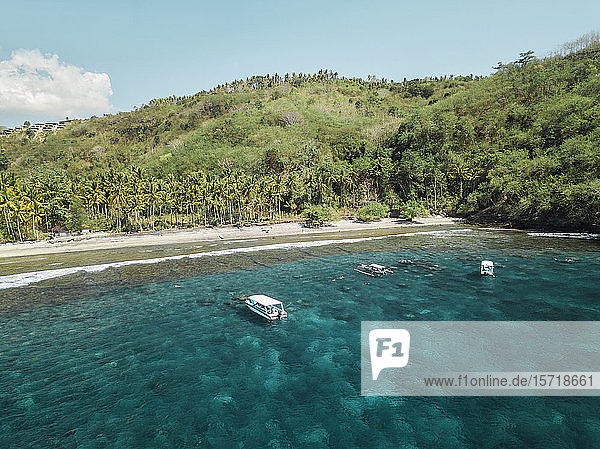 Indonesia Bali Boats floating in water at coast of Nusa Penida island