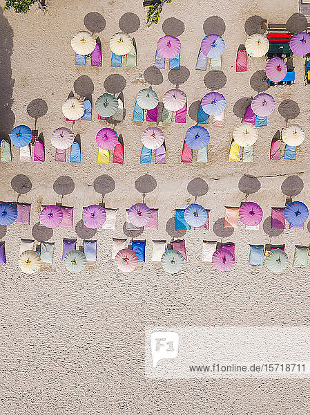 Indonesia Bali Nusa Dua Aerial view of colorful umbrellas on resort beach