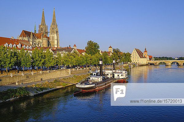 Germany  Bavaria  Regensburg  Ruthof-Ersekcsanad steamer moored on Danube river with Regensburg Cathedral in background