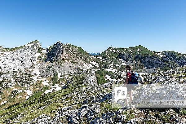 Young woman hiking  hiking trail  5-summit via ferrata  hike at the Rofan mountains  Haidachstellwand  Tyrol  Austria  Europe