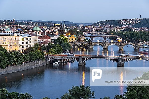 City view  bridges over the river Vltava  Charles Bridge with Old Town Bridge Tower and Water Tower  evening mood  Prague  Bohemia  Czech Republic  Europe