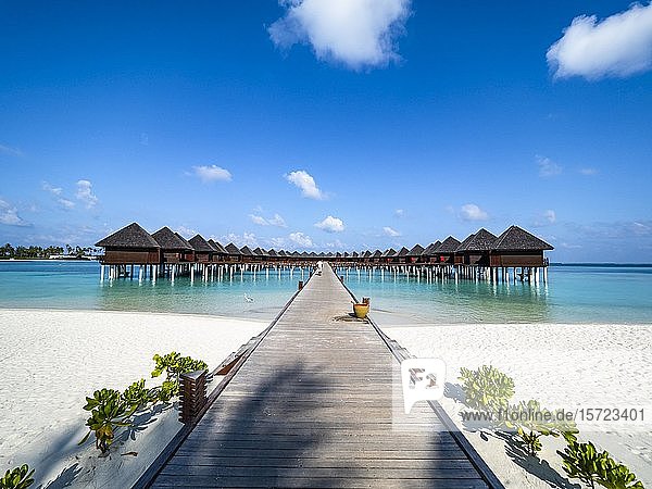 Footbridge over shallow water to water bungalows  island in South Male Atoll  Maldives  Asia