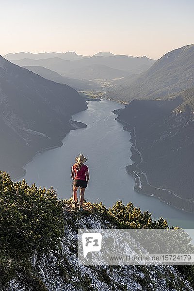 Young woman looking over mountain landscape  view from the mountain Bärenkopf to Lake Achensee  Tyrol  Austria  Europe