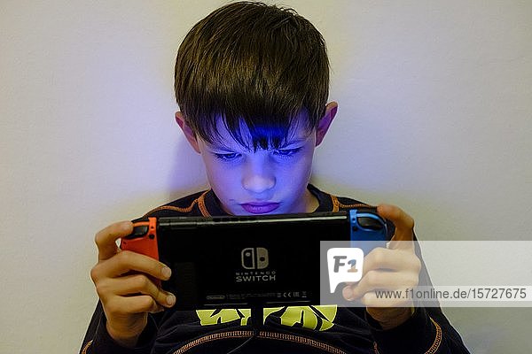 Boy  9 years  playing on Nintendo Switch  Germany  Europe