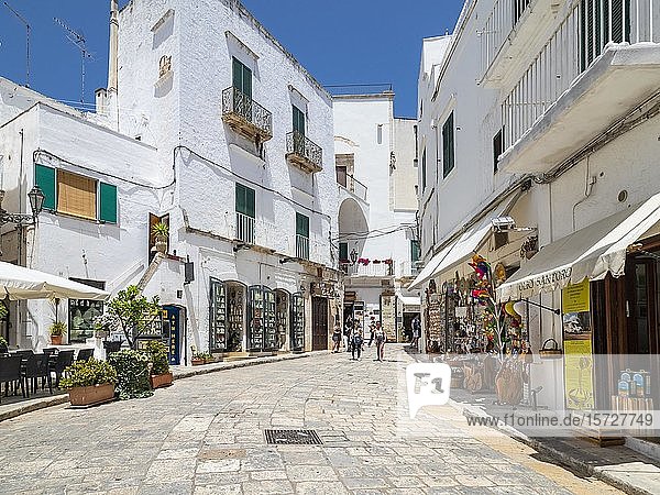 Shopping street through White Old Town  mountain village  Ostuni  Apulia  Italy  Europe