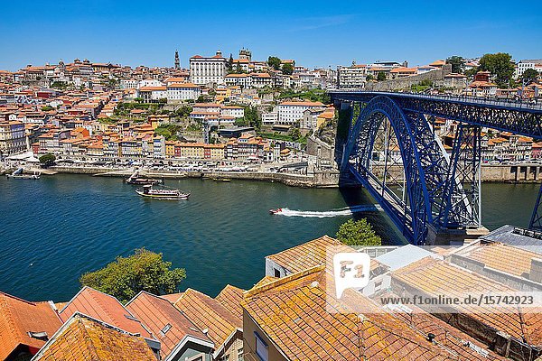 Tourist boat  Rio Douro river  Ponte Dom Luis I bridge  Porto  Portugal