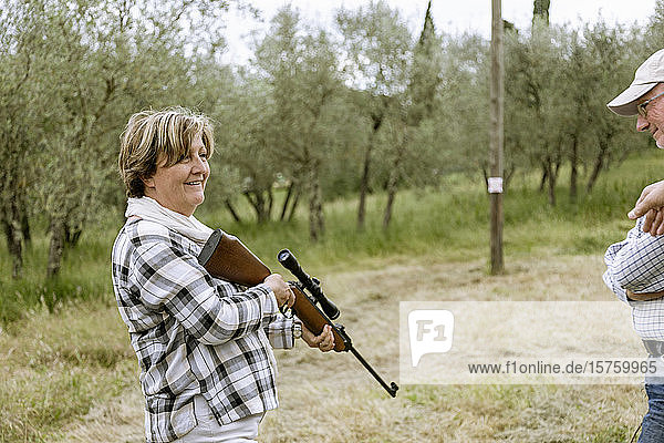 Senior woman at rifle target shooting  Florence  Italy