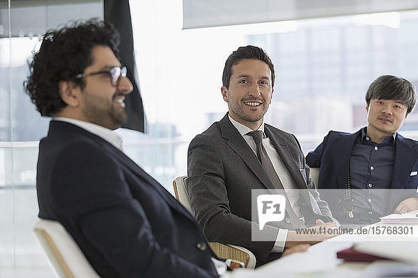 Portrait confident businessmen in conference room meeting