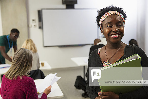 Portrait smiling  confident female community college student in classroom