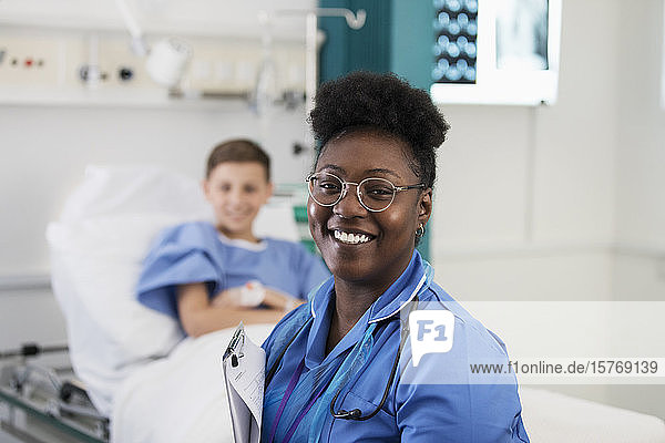 Portrait confident female nurse in hospital room