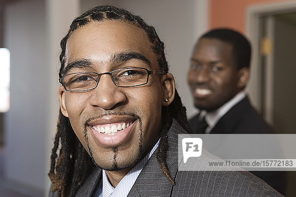 Portrait of a young businessmen smiling.