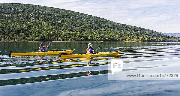 Brother and sister kayaking on White Lake  White Lake Provincial Park; British Columbia  Canada