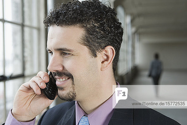 Close-up of a businessman talking on a mobile phone